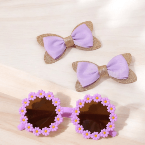Adorable bow tie and sunglasses combo designed to make any little girl shine! Available in a variety of bright, cheerful colors, this set is perfect for creating a coordinated, stylish look. The sunglasses feature a charming flower detail, while the matching bow ties add an extra touch of cuteness. Whether for a special occasion or everyday fun, this set is guaranteed to make her look super cute and feel fabulous! girl sunglasses and bow hair clips combo